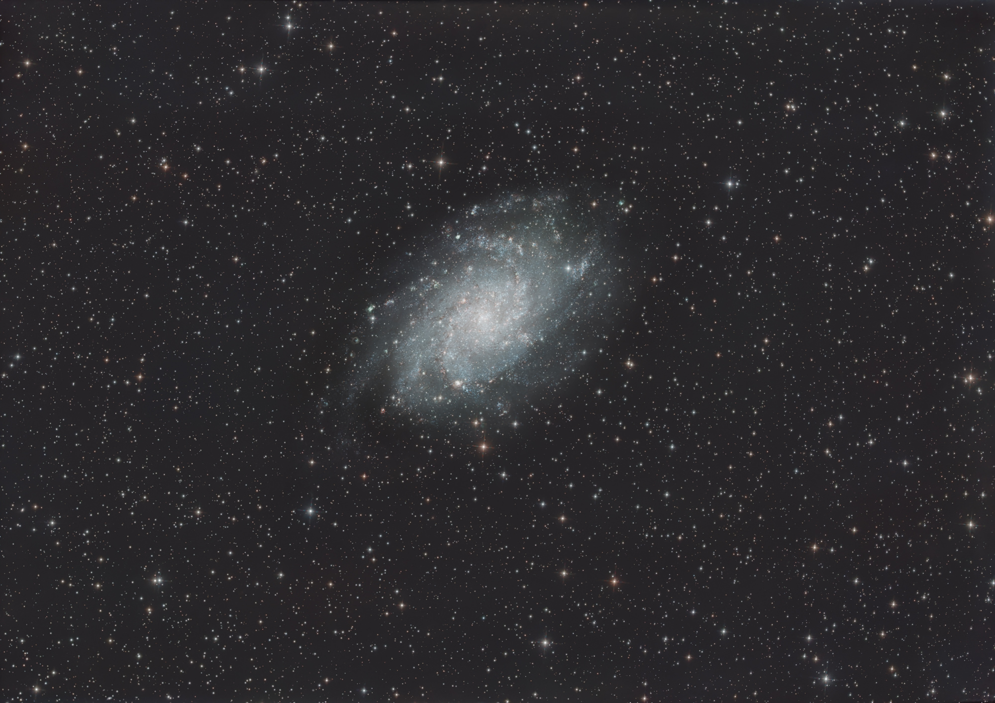 The Triangulum Galaxy, Messier 33 is a spiral galaxy in the constellation Triangle. It is the second brightest spiral galaxy in the northern night sky after the Andromeda galaxy.